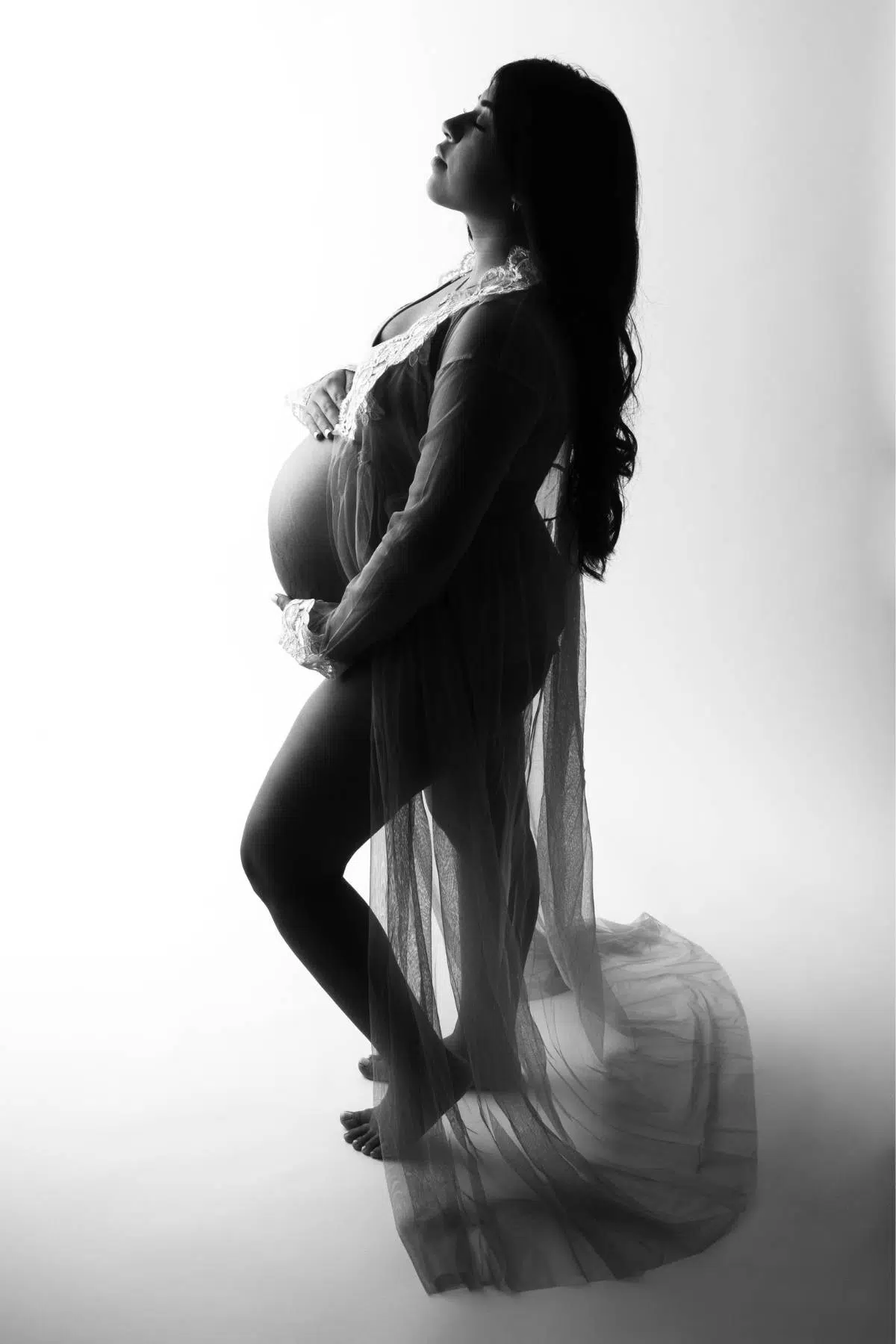 Award winning photographer photographed pregnant mother in sheer dress by Cynthia Hamilton Photography in Austin,Texas