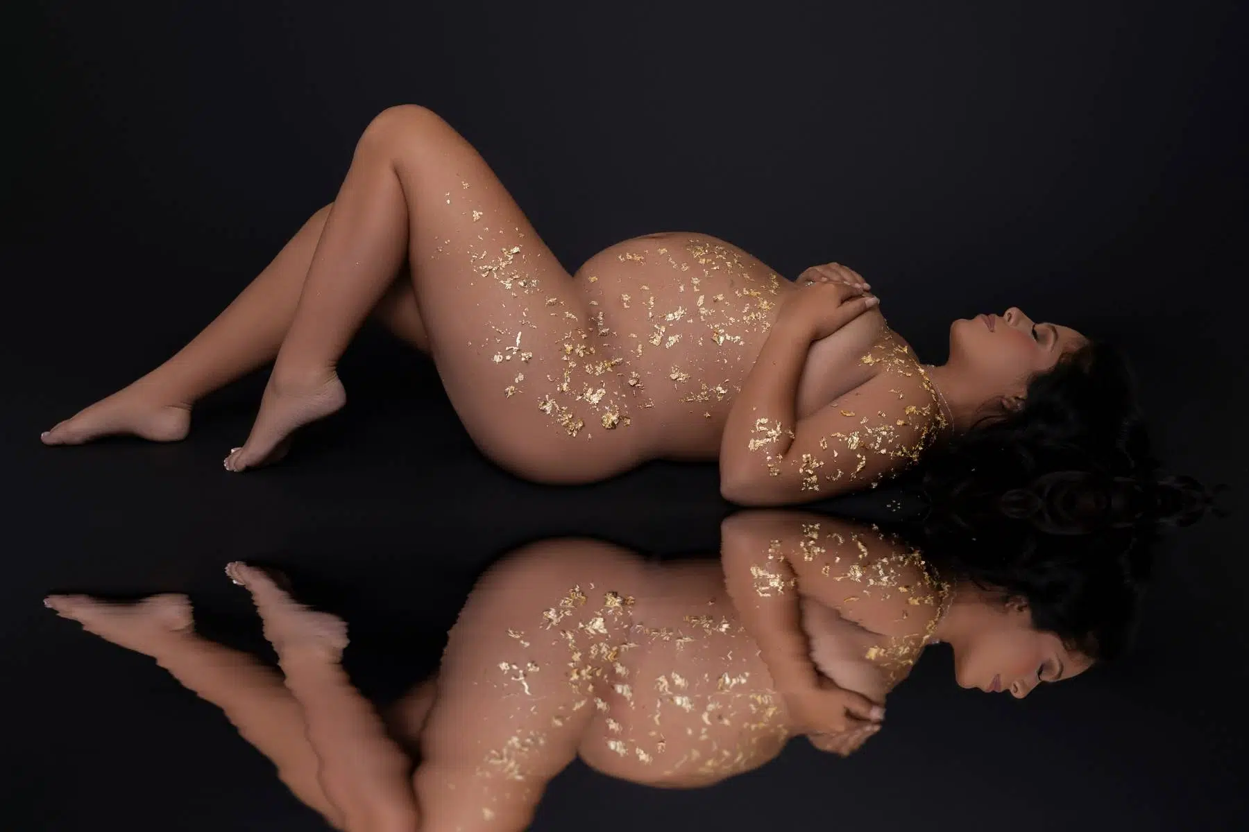 High end fine art milk bath Maternity Image of a pregnant mother with dress blue color photographed by Cynthia Hamilton Photography in Leander, Texas